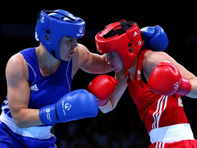 Savannah Marshall of Great Britain (red) and Nouchka Fontijn of the Netherlands (blue compete in the Women's Middle Weight (69-75kg) Round of 16 Bout during day seven of the Baku 2015 European Games at the Crystal Hall on June 19, 2015