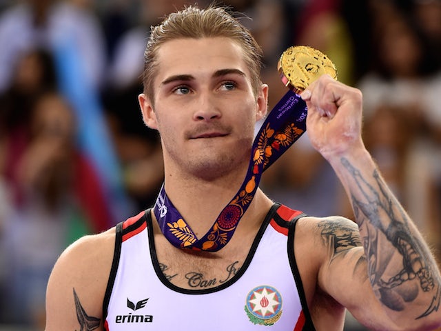 Gold medalist Oleg Stepko of Azebaijan poses with the medal won during the Men's Gymnastics Parallel Bars final on day eight of the Baku 2015 European Games at the National Gymnastics Arena on June 20, 2015 