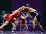 Ville Heino of Finland (red) and Piotr Ianulov of Macedonia (blue) compete in the Men's Wrestling 86kg Freestyle qualifications round during day six of the Baku 2015 European Games at the Heydar Aliyev Arena on June 18, 2015