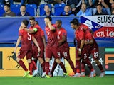 Portugal's players celebrate scoring during the UEFA Under21 European Championship 2015 football match between England and Portugal in Uherske Hradiste, Czech Republic on June 18, 2015