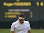 Switzerland's Roger Federer returns to the baseline after a point against Ukraine's Sergiy Stakhovsky during their second round men's singles match on day three of the 2013 Wimbledon Championships tennis tournament at the All England Club in Wimbledon, so