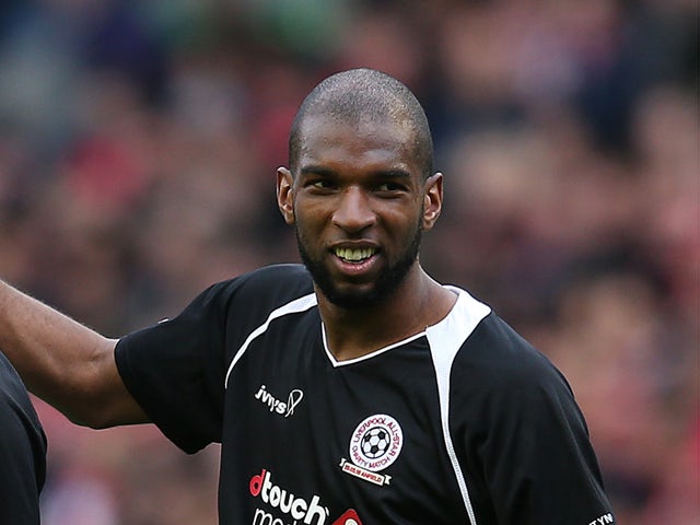 Ryan Babel (R) of the Gerrard XI at full time following the Liverpool All-Star Charity match at Anfield on March 29, 2015