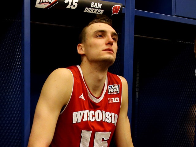 Sam Dekker #15 of the Wisconsin Badgers reacts in the locker room after being defeated by the Duke Blue Devils during the NCAA Men's Final Four National Championship at Lucas Oil Stadium on April 6, 2015