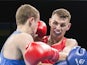 Ireland's Sean McComb (red) fights with Ukraine's Tymur Beliak during the mens light (60kg) round of 32 boxing fight at the 2015 European Games in Baku on June 18, 2015
