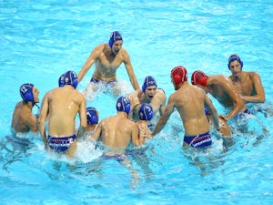 The Serbian team celebrate winning the Men's Waterpolo Semi Final against Greece during day seven of the Baku 2015 European Games at the Water Polo Arena on June 19, 2015