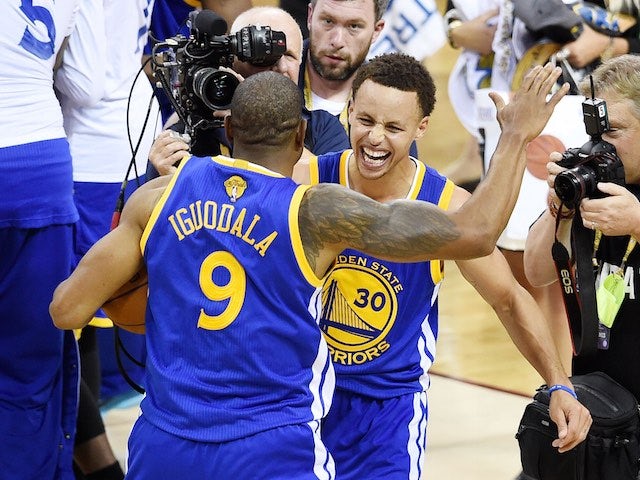 Andre Iguodala and Stephen Curry of the Golden State Warriors celebrate winning the NBA title on June 16, 2015