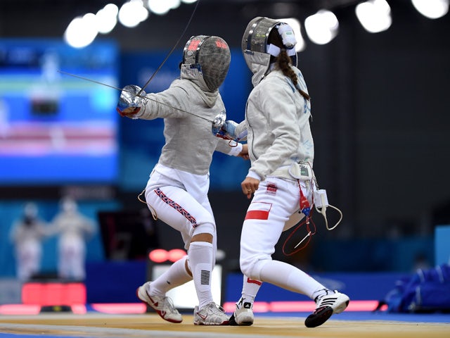 Aliya Itzkowitz of Great Britain (L) and Martyna Watora of Poland compete in the Women's Fencing Individual Sabre round of 32 match during day thirteen of the Baku 2015 European Games at the Crystal Hall on June 25, 2015