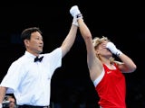 Anastasiia Beliakova (red) reacts as she is awarded the victory over Sandy Ryan of Great Britain after the Women's Light Welterweight 60-64kg bout during day thirteen of the Baku 2015 European Games at the Crystal Hall on June 25, 2015