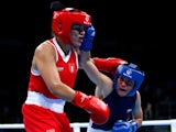 Valentina Alberti of Italy (red) and Aneta Rygielska of Poland (blue) compete in the Women's Boxing Light Welterweight (60-64kg) Semi Final during day thirteen of the Baku 2015 European Games at the Crystal Hall on June 25, 2015