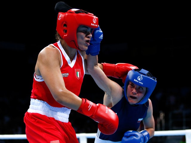 Valentina Alberti of Italy (red) and Aneta Rygielska of Poland (blue) compete in the Women's Boxing Light Welterweight (60-64kg) Semi Final during day thirteen of the Baku 2015 European Games at the Crystal Hall on June 25, 2015