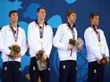Gold medalists Cameron Kurle, Daniel Speers, Martyn Walton and Duncan Scott of Great Britain celebrate on the podium prior to receiving the medals won during the Men's 4 x 100m Freestyle Relay final during day eleven of the Baku 2015 European Games at the