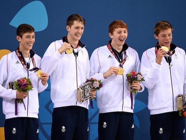Cameron Kurle, Daniel Speers, Martyn Walton and Duncan Scott celebrate winning gold for Team GB in the men's 4x100m freestyle at the European Games on June 23, 2015