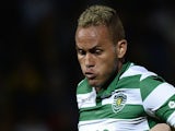 Sporting's Brazilian defender Ewerton (L) vies with Pacos Ferreira's midfielder Vasco Rocha during the Portuguese league football match FC Pacos de Ferreira vs Sporting CP at the Capital do Movel stadium in Pacos de Ferreira on April 4, 2015