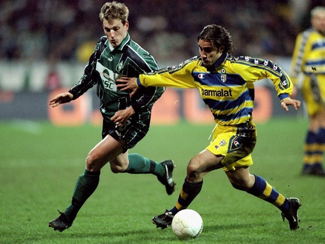 Andreas Herzog of Werder Bremen chases Fabio Cannavaro of Parma during the UEFA Cup fourth round second leg game between Werder Bremen and Parma at the Weserstadion in Bremen, Germany