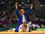 Gemma Howell of Great Britain (white) reacts as Mia Hermansson of Sweden (blue) celebrates victory in the Women's Judo -63kg elimination round of 16 contest during day fourteen of the Baku 2015 European Games at the Heydar Aliyev Arena on June 26, 2015