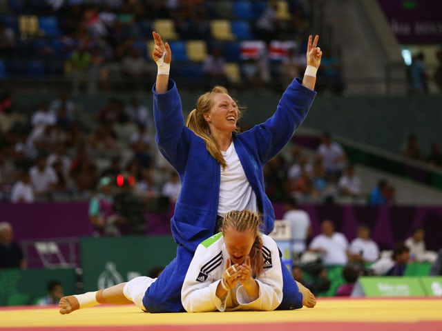 Gemma Howell of Great Britain (white) reacts as Mia Hermansson of Sweden (blue) celebrates victory in the Women's Judo -63kg elimination round of 16 contest during day fourteen of the Baku 2015 European Games at the Heydar Aliyev Arena on June 26, 2015