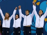Team GB swimmers Georgia Coates, Amelia Clynes, Charlie Attwood and Luke Greenbank celebrate claiming silver in the mixed 4x100m medley at the European Games on June 26, 2015