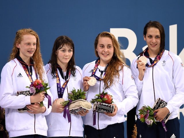 Bronze medalists Georgia Coates, Hannah Featherstone, Madeleine Crompton and Darcy Deakin of Great Britain pose on the medal podium for the Women's Swimming 4 x 100m Freestyle Relay during day eleven of the Baku 2015 European Games at the Baku Aquatics Ce