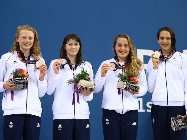 Team GB's Georgia Coates, Hannah Featherstone, Madeleine Crompton and Darcy Deakin hold their bronze medals proudly after the women's 4x100m freestyle at the European Games on June 23, 2015