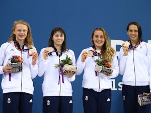 Team GB's Georgia Coates, Hannah Featherstone, Madeleine Crompton and Darcy Deakin hold their bronze medals proudly after the women's 4x100m freestyle at the European Games on June 23, 2015