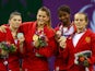Silver medalist Volha Namazava of Belarus, gold medalist Ivana Jandric of Serbia and bronze medalists Celine Conde of France and Olga Zakhartsonva of Russia pose during the medal ceremony for the Women's Sambo -67kg on day ten of the Baku 2015 European Ga