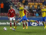 John Guidetti of Sweden scores a penalty during UEFA U21 European Championship semi final match between Denmark and Sweden at Generali Arena on June 27, 2015