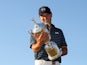 Jordan Spieth poses with the US Open trophy after winning at Chambers Bay on June 21, 2015