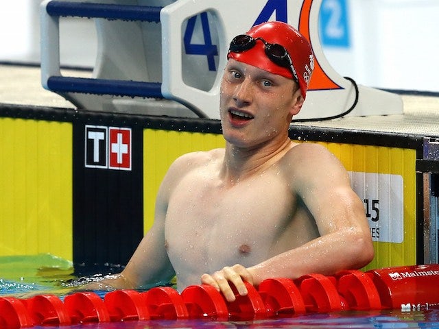 Luke Greenbank celebrates winning the men's 100m backstroke at the European Games on June 24, 2015