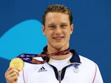 Luke Greenbank poses with his gold medal after winning the men's 200m backstroke at the European Games on June 26, 2015