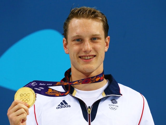 Luke Greenbank poses with his gold medal after winning the men's 200m backstroke at the European Games on June 26, 2015