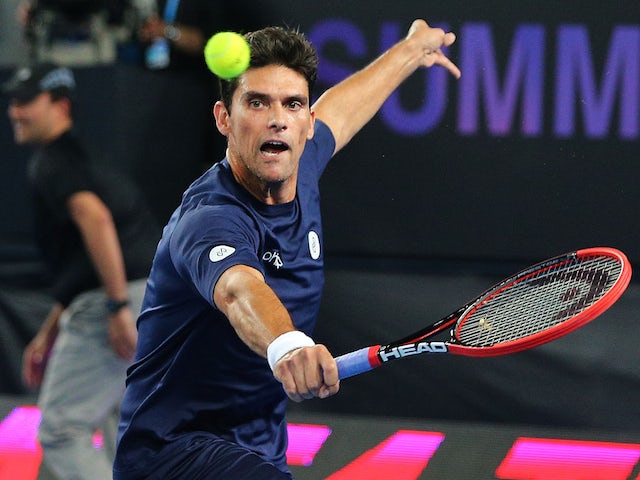 Mark Philippoussis of Australia hits a backhand in his match against Rafael Nadal of Spain during Rafa's Summer Set at Melbourne Park on January 14, 2015