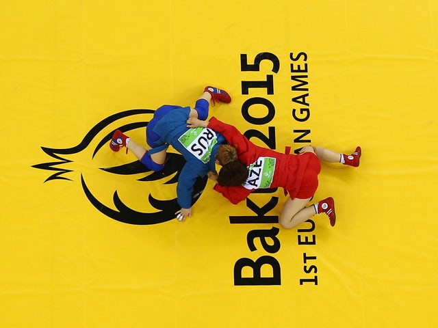 Nazakat Khalilova of Azerbaijan (red) and Anna Kharitonova (blue) of Russia compete during the Women's Sambo -52kg gold medal bout during day ten of the Baku 2015 European Games at the Heydar Aliyev Arena on June 22, 2015