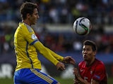  Raphael Guerreiro (R) of Portugal battles for the ball with Branimir Hrgota (L) of Sweden during UEFA U21 European Championship Group B match between Portugal and Sweden at Mestsky Fotbalovy Stadium on June 24, 2015
