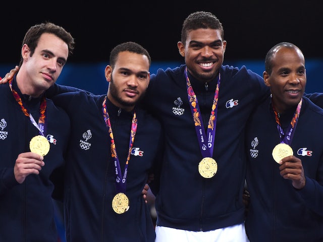 Ronan Gustin, Jerel Dent, Yannick Borel and Ivan Trevejo of France pose on the medal podium follwoing their win over Russia in the Men's Fencing Team Epee Final on day fifteen of the Baku 2015 European Games at the Crystal Hall on June 27, 2015