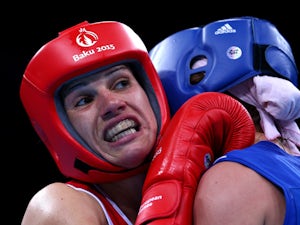 Stanimira Petrova of Bulgaria (red) and Anna Alimardanova of Azerbaijan (blue) compete in the Women's Boxing Bantamweight (51-54kg) Quarter Final during day eleven of the Baku 2015 European Games at the Crystal Hall on June 23, 2015