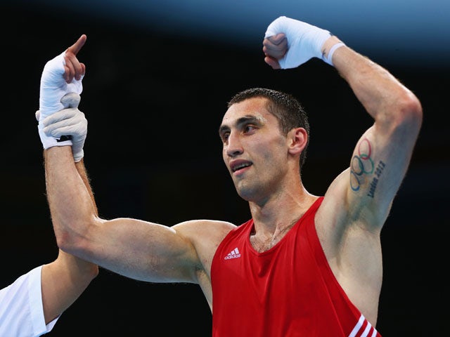 Teymur Mammadov of Azerbaijan celebrates victory over Peter Mullenberg of the Netherlands in the Men's Boxing Light Heavyweight (81kg) Quarter Final during day ten of the Baku 2015 European Games at the Crystal Hall on June 22, 2015