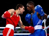 Viktor Petrov (red) of Ukraine and Collazo Sotomayor (blue) of Azerbaijan compete during the Men's Boxing Light Welter (64kg) semi final on day thirteen of the Baku 2015 European Games at the Crystal Hall on June 25, 2015