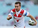 Adam Quinlan of the Dragons makes a break during the round 20 NRL match between the Wests Tigers and the St George Illawarra Dragons at ANZ Stadium on July 27, 2014