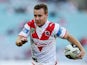 Adam Quinlan of the Dragons makes a break during the round 20 NRL match between the Wests Tigers and the St George Illawarra Dragons at ANZ Stadium on July 27, 2014
