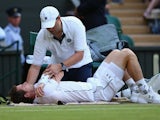 Andy Murray of Great Britain receives treatment to an injury in his Mens Singles Third Round match against Andreas Seppi during day six of the Wimbledon Lawn Tennis Championships at the All England Lawn Tennis and Croquet Club on July 4, 2015