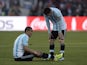 Argentina's forward Angel Di Maria (L) remains on the ground after getting injured next to Argentina's forward Lionel Messi during their 2015 Copa America final football match, in Santiago, Chile, on July 4, 2015