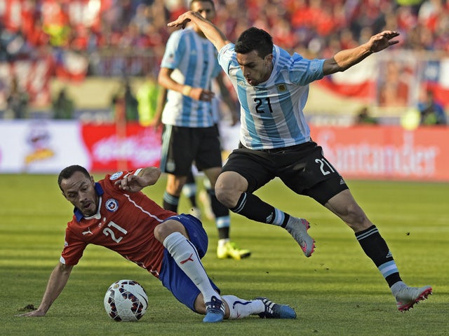 Argentina's midfielder Javier Pastore and Chile's midfielder Marcelo Diaz vie for the ball during their 2015 Copa America football championship final, in Santiago, Chile, on July 4, 2015