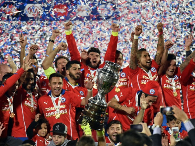 Chilean players celebrate with the trophy of the 2015 Copa America football championship, in Santiago, Chile, on July 4, 2015
