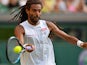 Germany's Dustin Brown returns against Spain's Rafael Nadal during their men's singles second round match on day four of the 2015 Wimbledon Championships at The All England Tennis Club in Wimbledon, southwest London, on July 2, 2015