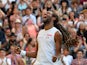 Germany's Dustin Brown celebrates beating Spain's Rafael Nadal during their men's singles second round match on day four of the 2015 Wimbledon Championships at The All England Tennis Club in Wimbledon, southwest London, on July 2, 2015