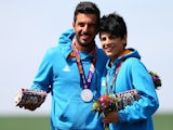 Silver medalists Georgios Achilleos and Andri Eleftheriou of Cyprus stand on the podium during the medal ceremony for the Mixed Team Skeet Shooting on day ten of the Baku 2015 European Games at the Baku Shooting Centre on June 22, 2015
