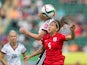 England's Fara Williams (C) and Germany's Melanie Behringer vie for the ball during the bronze medal match at the FIFA Women's World Cup in Edmonton, Alberta on July 4, 2015