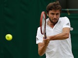 France's Gilles Simon returns to Slovenia's Blaz Kavcic during their men's singles second round match on day four of the 2015 Wimbledon Championships at The All England Tennis Club in Wimbledon, southwest London, on July 2, 2015
