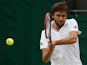 France's Gilles Simon returns to Slovenia's Blaz Kavcic during their men's singles second round match on day four of the 2015 Wimbledon Championships at The All England Tennis Club in Wimbledon, southwest London, on July 2, 2015