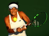 Heather Watson of Great Britain in action in her Ladies Singles first round match against Caroline Garcia of France during day one of the Wimbledon Lawn Tennis Championships at the All England Lawn Tennis and Croquet Club on June 29, 2015